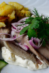 Matjes Fillet Hausfrauenart, Young Pickled Herring Housewife Style with Apples and Sour Cream, with Roast Potatoes and Salad