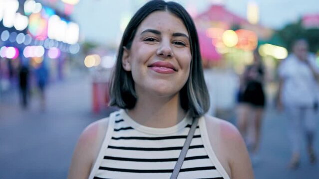 Young beautiful hispanic woman smiling confident standing at Prater Vienna