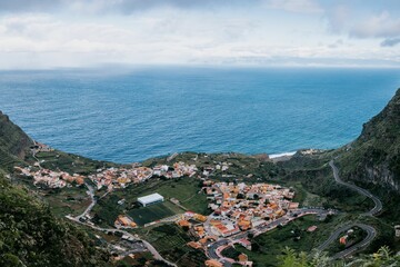Stunning landscape featuring a lush green mountain peak and a blue ocean, La Gomera, Canary Islands