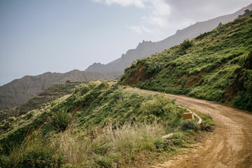 Empty road through the mountains to a rocky shore, La Gomera, Spain, Canary Islands