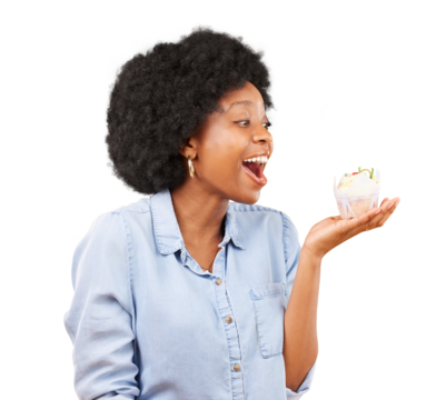 Excited, surprise and cupcake in hands of a woman eating sweet food isolated on transparent, png background. African female model with afro and dessert for motivation, birthday or celebration