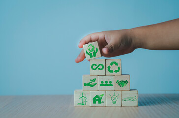 Children's hands and imagination on wooden blocks The concept of renewable energy, family, love of nature, environmental technology. green technology