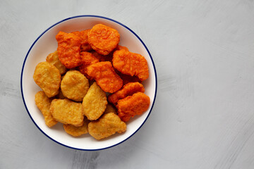 Homemade Spicy Chicken Nuggets Mix with Ketchup, top view. Copy space.