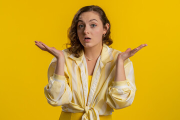 What Why. Sincere irritated young woman raising hands in indignant expression, ask reason of...