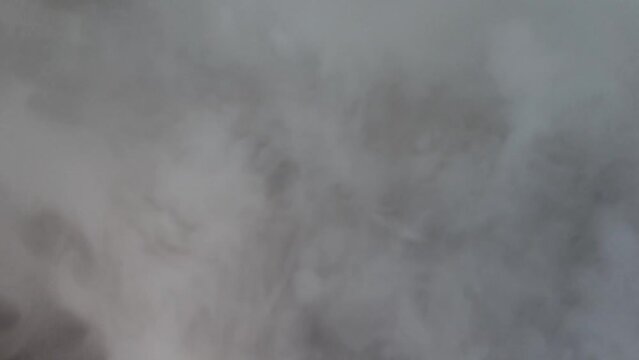 Dry ice boiling vapor dense background.
