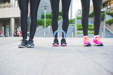 Close up women wearing jogging and running shoes outdoors