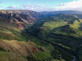 Aerial view of green mountains in Waimea Canyon State Park in Kauai County, Hawaii