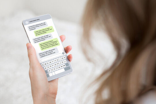 Woman texting with phone outdoors. Text message with smartphone