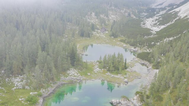 Aerial Exploration of a Lake and Cabin in the Seven Lakes Valley near Triglav, Slovenia