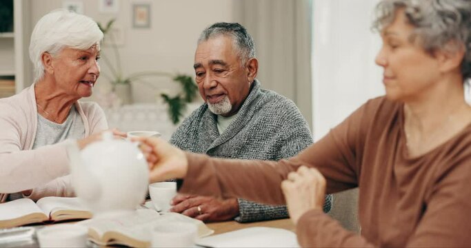 Senior, book and friends with tea at a table for reading, retirement meeting and hobby together. Talking, happy and an elderly man with women, coffee and food with a discussion about a story