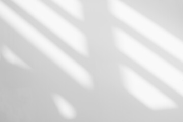 Gray shadow and light blur abstract background on white wall  from window. Dark stripe grey shadows...
