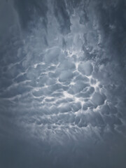 Mammatocumulus or Mammatus clouds formations. Abstract background of wonderful storm cloudscape....