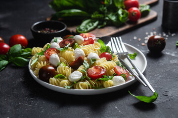 Pasta with mozzarella and tomatoes .Pasta caprese