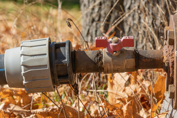 Valve and connecting pipes of old automatic watering. Turn off or turn on water switch. Regulator...