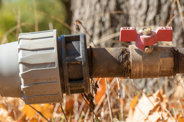 Valve and connecting pipes of old automatic watering. Turn off or turn on water switch. Regulator...