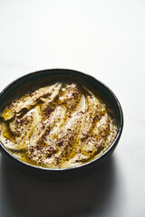 Mutabal or Moutabal - Middle Eastern dip made from roasted eggplants with tahini, garlic and lemon juice. It's creamy, smoky, and tangy.