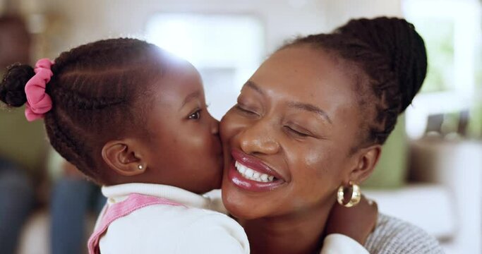 Kiss, hug and girl with mother, love and happy with fun, quality time and care with bonding in a lounge. Black family, mama or female child with a smile, parent or home with kid, embrace or happiness