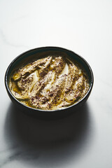Mutabal or Moutabal - Middle Eastern dip made from roasted eggplants with tahini, garlic and lemon juice. It's creamy, smoky, and tangy.
