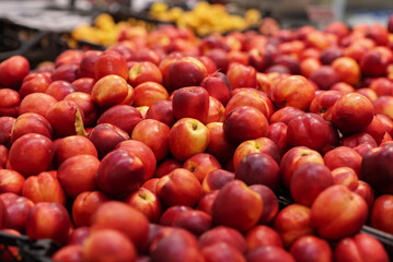 A large bunch of sweet peach. The fruit is an organically grown produce. Sold in Supermarket