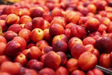 A large bunch of sweet peach. The fruit is an organically grown produce. Sold in Supermarket