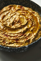 Eggplant hummus. Classic hummus makes with baked on roasted eggplants and garlic. Chickpeas and tahini processed with eggplant, roasted garlic and spices like paprika, salt and cumin. 