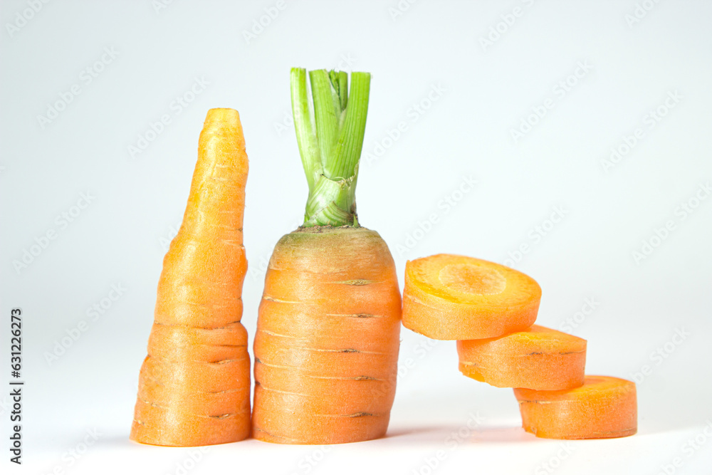 Sticker Sliced carrots on a white background. Delicious and healthy vegetable