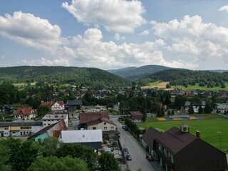 Fototapeta na wymiar Scenic aerial view of a small rural town featuring an array of clustered buildings and green fields