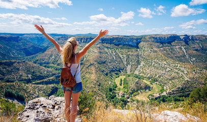 Hiker woman enjoying panoramic view of Cirque de Navacelles- Occitanie, South of ...