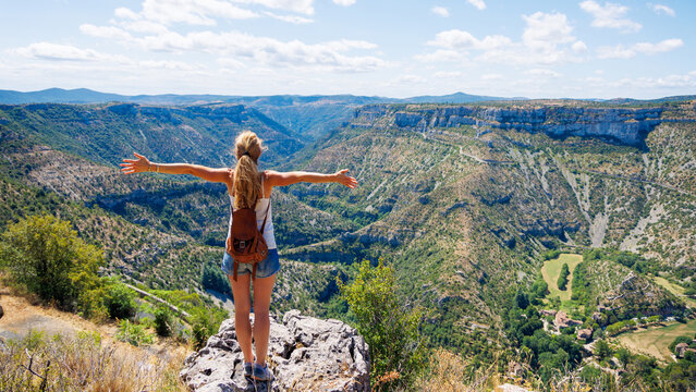 Woman traveler in mountain and canyon- Cirque de Navacelles- Travel, tourism,active life,adventure concept