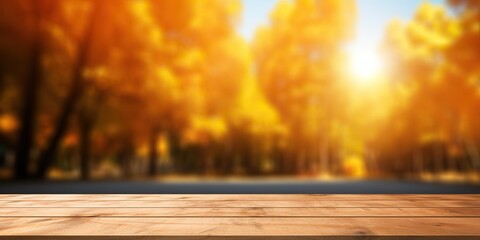 Wooden planks against the background blurred of trees in a beautiful autumn park. Autumn background for presentation