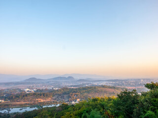 Fototapeta na wymiar Natural viewpoint, mountains, hills, forests and river under morning mist in Chiangrai, Thailand