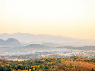 Obraz premium Natural viewpoint, mountains, hills, forests and river under morning mist in Chiangrai, Thailand