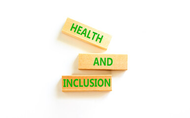 Health and inclusion symbol. Concept words Health and inclusion on wooden block. Beautiful white table white background. Business motivational health and inclusion concept. Copy space.