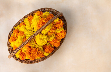 Top view of yellow orange flowers with basket, Onam flower background