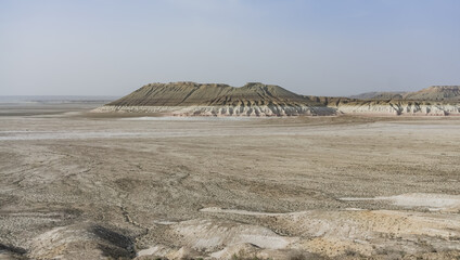 Panorama of layered mountains and hillsides in Kazakh steppe, desert with chalk and limestone hills