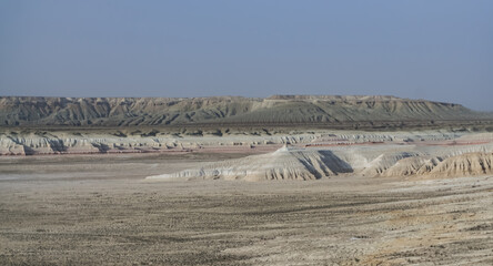 Panorama of layered mountains and hillsides in Kazakh steppe, desert with chalk and limestone hills