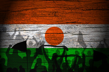 Republic of Niger flag painting on wood and peoples shadow