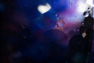 Photo of oil on a water surface with bubbles. Abstract colorful background. Macro close-up, not...