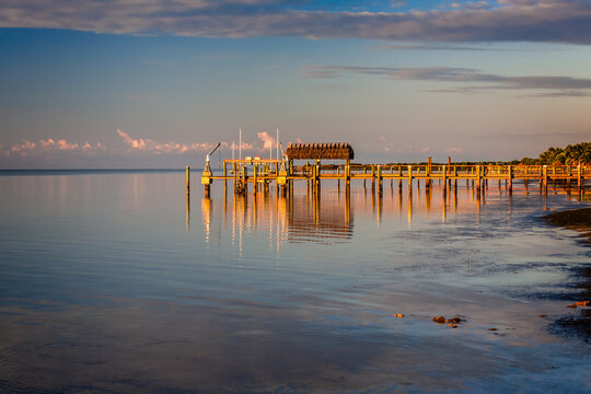 Long dock sticks out a long way in shallow water of Key West