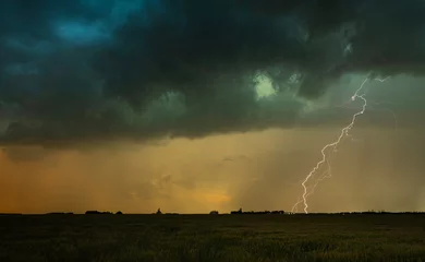 Fotobehang Lightning strike with a dramatic sky © Greg