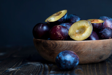Ripe plums on the table in the kitchen