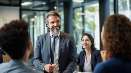 Businessman gives a speech to his coworkers in a modern office.