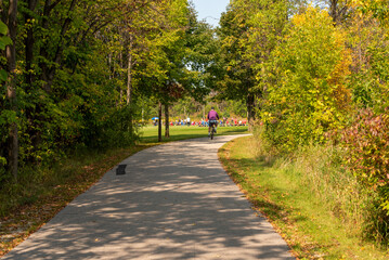 Bicycle On The Trail With A Soccer Game In The Distance In Fall