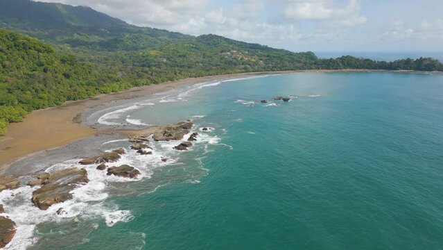 Aerial drone video of the coastline and beach of Dominicalito in Costa Rica