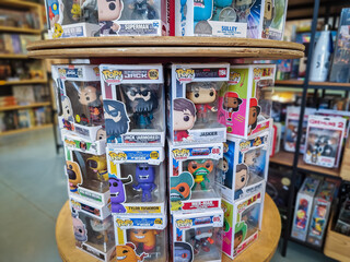 Obraz premium Tallinn, Estonia - July 11, 2023: Funko POP with different popular movie character toys on a shelf. Funko Inc is American company that manufactures licensed and limited pop culture collectibles.