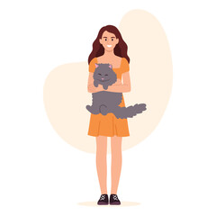 Cute girl holding a gray cat in her arms