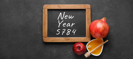 Greeting card for Rosh Hashanah celebration (Jewish New Year) with honey and fruits