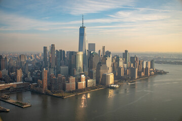Fototapeta na wymiar New York City Skyline From a Helicopter during sunset with Word Trade Center One