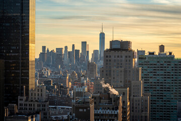 Fototapeta na wymiar New York Skyline Sunset Golden Hour with One Word Trade Center in the background