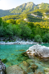 crystal clear turquoise Soca river in Slovenia near Kobarid and Bovec famous for sport activities rafting kayaking